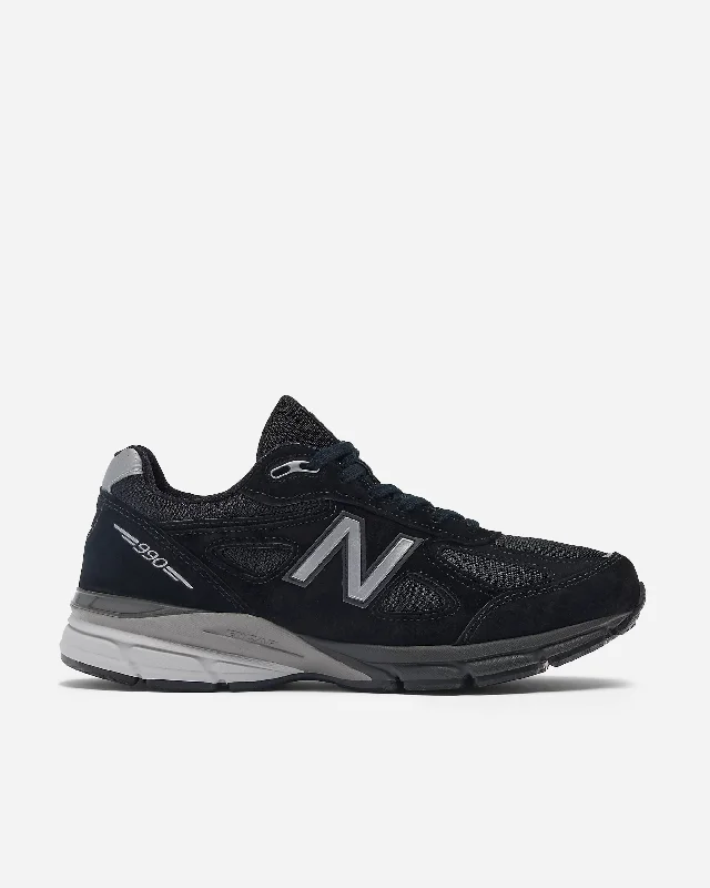 Men's black canvas sneakers with a red sole990v4