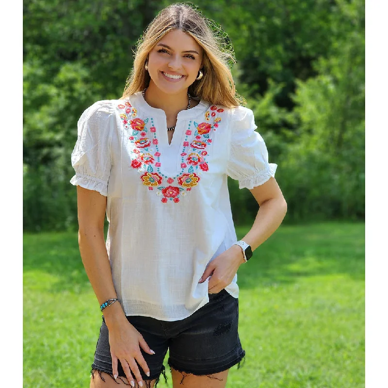 Men's western boots with a tooled leather design on the shaftWhite Floral Blouse